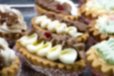 Abstract and blurry background of cakes with cream close-up.の写真素材