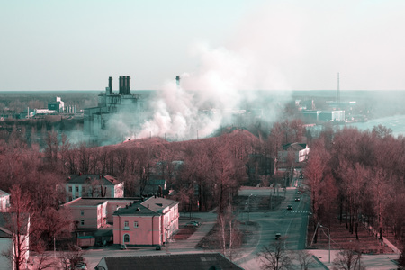 Fire and white smoke in a small townの写真素材