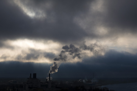 smoke from the plant in cloudy weatherの写真素材