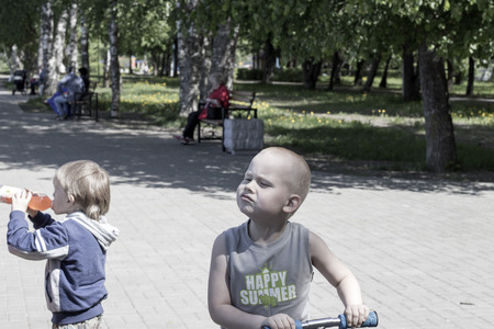 Park, children in the park and people in the background May 27, 2018, Russia, Leningrad region, the city of Kirovsk.のeditorial素材
