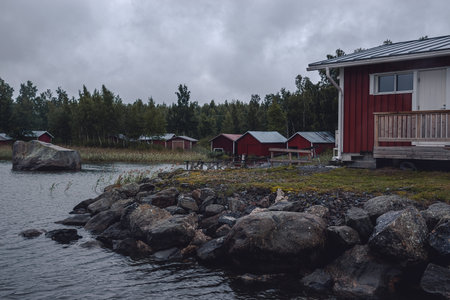red wooden houses on the seashore in harrstron finlandの写真素材
