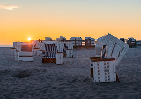 beach chairs on the shore of the North Sea in St. Peter-Ording, Germanyの写真素材