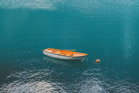 orange boat on a mountain lake in Norway. view from above.
