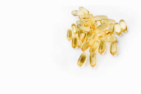 Many softgel or gelcap transparent capsule pills with omega 3 and vitamins c and d as medicine to boost immunity during global coronavirus covid-19 pandemic and quarantineの写真素材