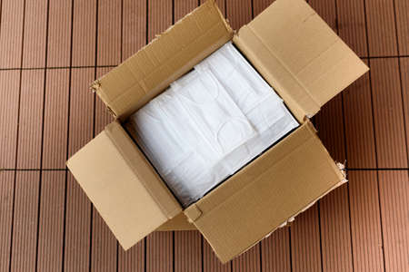 Top view of opened box of surgical face masks, corona virus covid 19 global pandemicの写真素材