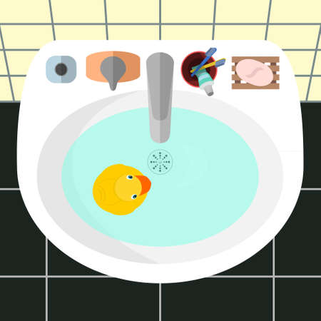 Cartoon vector illustration. Top view on a sink in a bathroom with the yellow rubber duck and the main bath accessories: soap, toothbrushes, toothpaste, cream.  Yellow tile on walls and black on a floor as a background.のイラスト素材