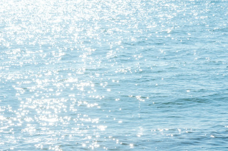 Sea blurred background with glare. Summer shiny day