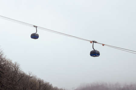Funicular in the fog. Rainy day at mountains.の写真素材