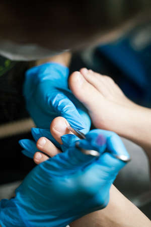 pedicure procedure in a beauty salon close-up. High quality photoの写真素材
