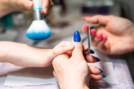 womens manicure in a beauty salon close-up. High quality photoの写真素材
