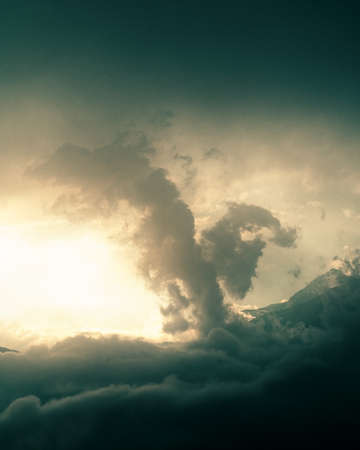 mystical sunset sky with clouds in the mountains. High quality photoの写真素材