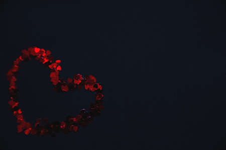 Shiny hearts are a symbol of love. The heart of small hearts.Creative ideaの写真素材