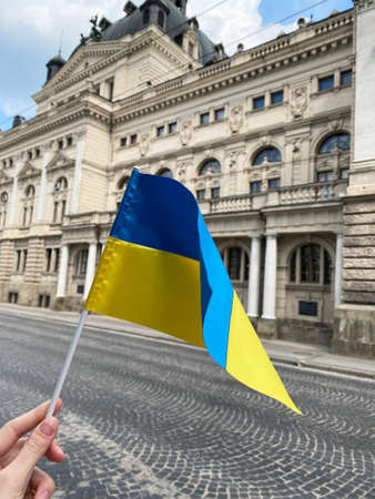 The national flag of Ukraine is flying in the city of Lviv in beautiful sky.の写真素材