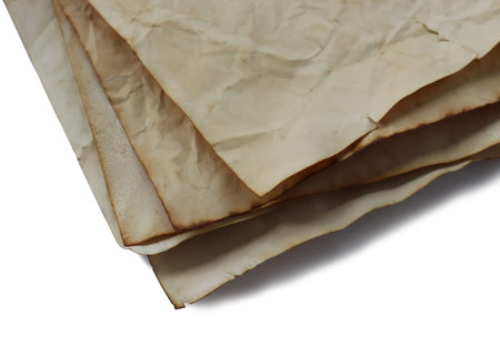 Stack of vintage old paper on isolated white backgroundの写真素材
