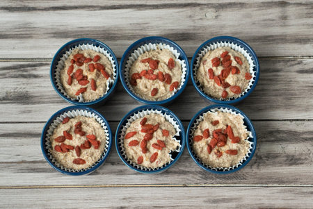 Raw goji berry muffin dough before baking.