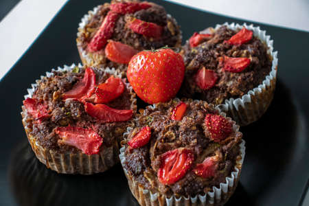 Chocolate Nut Flour Strawberry Muffins for the Keto Diet, Black Plate Close-upの写真素材