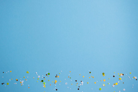 Blue background made of paper and large round glitter. Glitter vignetting. Flat view, layout design for lettering or drawingsの写真素材