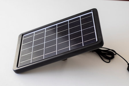 Small solar panel on a white background. Sustainability, caring for the environment.の写真素材