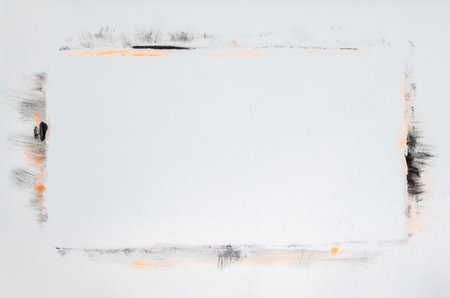 Grunge frame painted on a white textured background, strokes of black and orange. Blank space for...