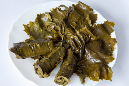Pickled grape leaves in close-up. Grape leaves for traditional oriental dolma dishes and snacks on a...