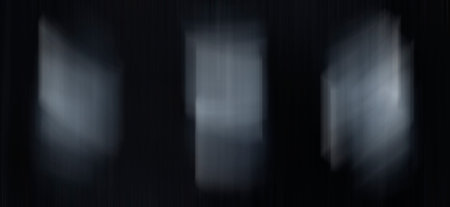 3 white spots on a black background in motion. Space for text and design.