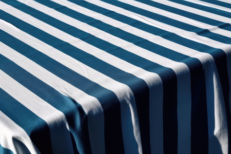 Blue and white striped tablecloth as background, closeup of photoの素材
