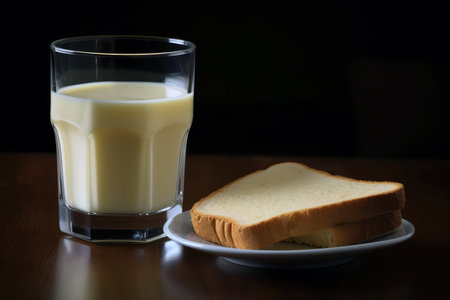 Glass Of Milk And Slice Of Buttered Toast. World Milk Dayの素材