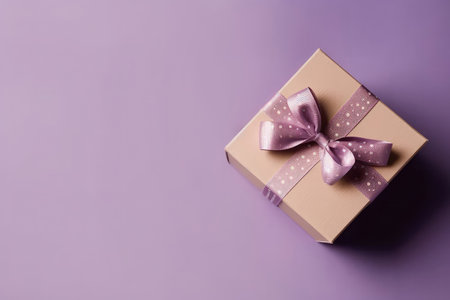 Box With Bow On Lavender Color Background, Top View, Copy Spaceの素材