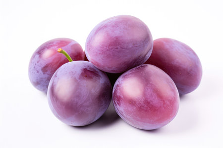 Purple Plums Closeup On White Backgroundの素材