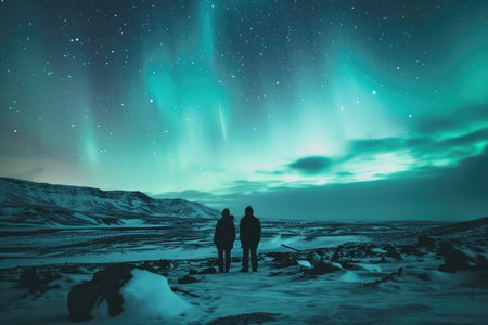 Tourists Watch The Northern Lights In Iceland.の素材