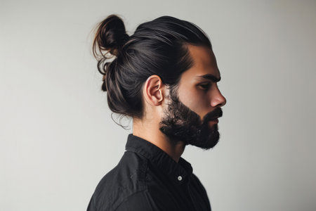 Man With Traditional Hairstyle On Plain Backgroundの素材