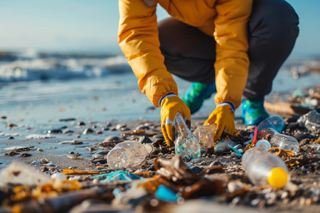 Close-Up View Of An Earth Day Volunteer Dedicated To Cleaning A Littered Beach.の素材