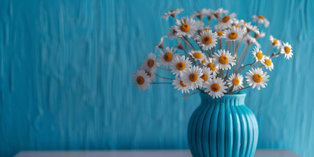 A vibrant arrangement of daisies in a blue vase perfectly complements the artistic setting. Concept Floral Still Life, Artistic Arrangement, Vibrant Colors, Blue Vase, Daisiesの素材