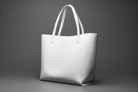 A white tote bag on a gray background ready for customization. Concept Customization, White Tote Bag, Gray Backgroundの素材
