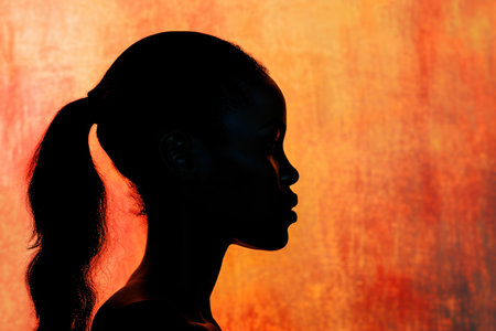Profile Of A Woman With A Ponytail: Silhouetted Styleの素材