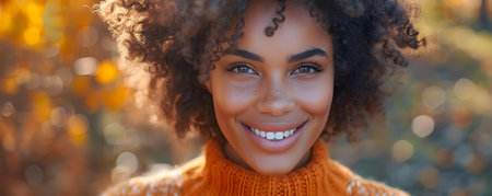 Portrait of a Happy Young Woman in an Orange Sweater on an Orange Background. Concept Outdoor Photoshoot, Colorful Props, Joyful Portraits, Playful Posesの素材