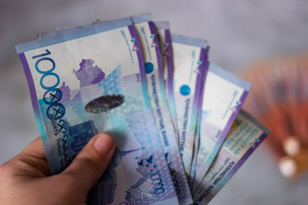 Hands holding banknotes of the Ukrainian hryvnia.の写真素材