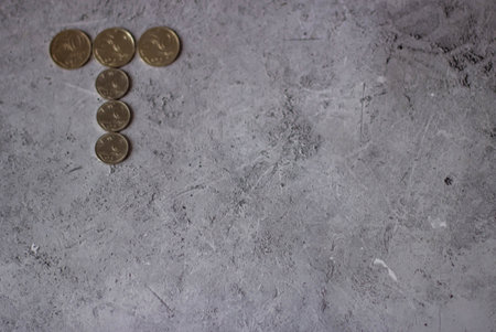 Euro coins on gray concrete background. Money concept. Copy space for text.の写真素材