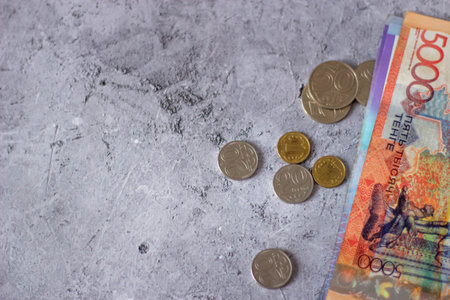 Close up of Thai banknotes and coins on concrete background with copy spaceの写真素材