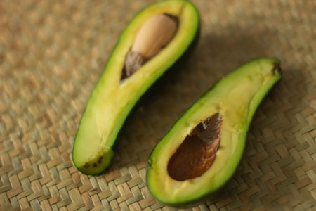 Avocado on bamboo mat, close up. Healthy food concept.の写真素材