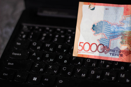Close up of a computer keyboard and banknotes of 500 euros.
