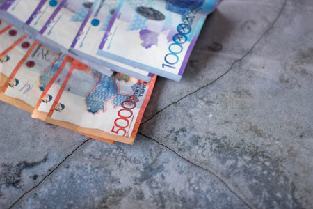 Thai baht banknotes on the cement floor background.