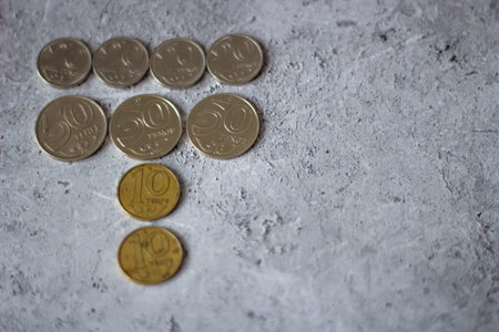 Coins of the European Union on a gray concrete background. Selective focus.の写真素材