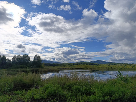 Landscape with a lake and blue sky with clouds, Siberia, Russiaの写真素材
