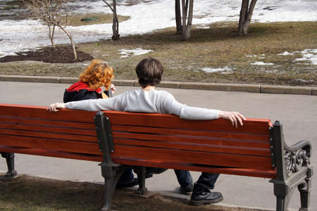 spring song on bench in parkの写真素材