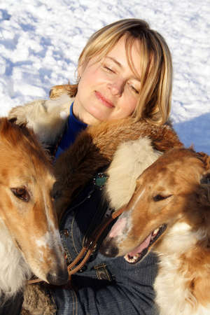 woman with the thoroughbred borzoi dogの写真素材