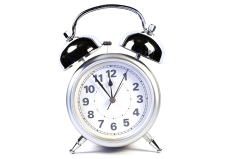 photo of a retro alarm clock in white backgroundの写真素材