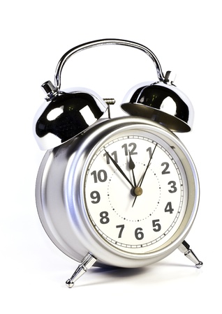 photo of a retro alarm clock in white backgroundの写真素材