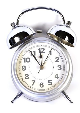 photo of a retro alarm clock in white backgroundの写真素材