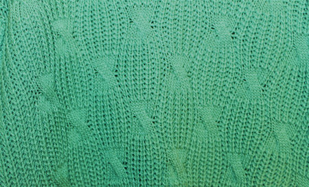 Solid color knitted background with pattern. Machine knit. Background for design and graphic resources. Empty space to insert text.の写真素材